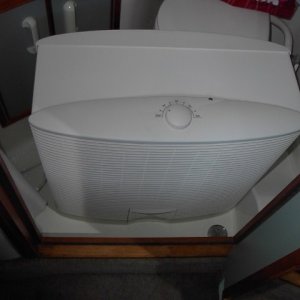 Evaporate cooler works well in dry climate of Northern California. Here it's setting on the floor of the bathroom, but fits under dinette, on galley floor, out in cockpit, etc.