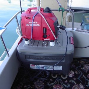 Generator is mounted off-center so that it can be turned different ways to accomodate the situation where it's being run, and also to project exhaust as far to one side as possible.