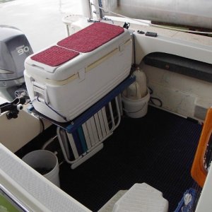 Bungee cords hold the cooler down.