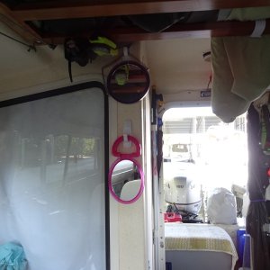 Hooks for towels, mirrors, fly swatter?? Also there is an emergency flash light and the PLB right above the upper mirror.  These are in "Grab and go" mounts.
