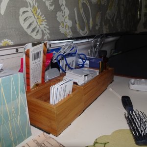 Boxes to hold misc items at outboard end of dinette table