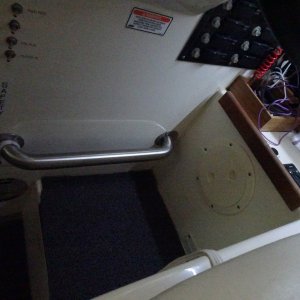 foot rest for helmsman. several bamboo boxes for commonly used tools and navigation instruments.  To the right is the on/off for rear view, the windshield wiper delay system.
