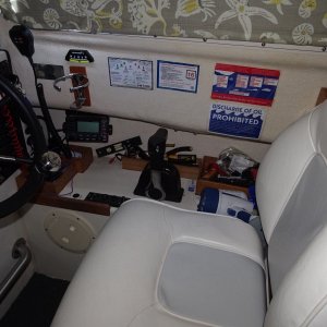 After market helm seat.  also note the windshield wiper control close by, the boxes in the background for often used tools and other items.