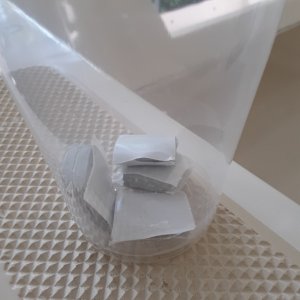 I cut little squares from a roll of butyl tape to put where the fasteners go.  I was originally going to roll the butyl tape but I felt this would work better.  I dont want any water trapped in the rub rail, and I thought that this would allow it to drain.  I also am not going to caulk the top or bottom of the rain after its all tightened up.