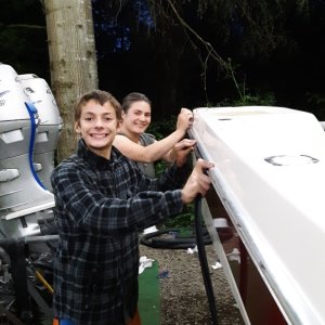 Josie and Logan putting in the rubber strip