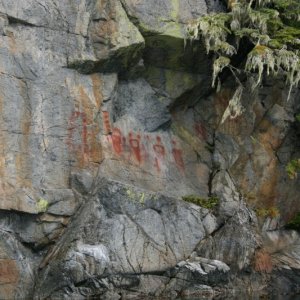 Pictographs in Queen Charlotte Sound. Coppers, moons or suns and a hand and forearm.