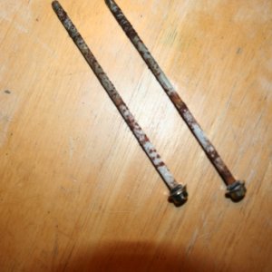 these two bolts pass thru the motor and hold the brush plate and motor in place, the are covered in corrossion