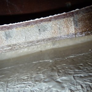 Media '5. Looking directly aft to the bulkhead under the cabin door.' in album '1. Galley floor access  hole, just in front of the cabin door. This void area collected several gallons of salt water comming directly from a misplaced drainage hole in the anchor locker.'
