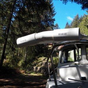 Media 'The "custom" frame piece at the bow made by using a hot air gun to bend the pipe.' in album 'Four 10 foot lengths of PVC pipe laid between the cabin top hand hold and the "bump" in the CD 16 cabin top.'
