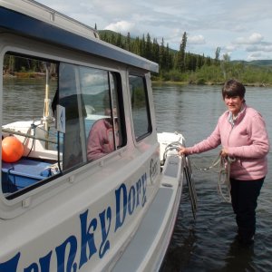 Grounded with both motors up.  We both had to get out of the boat & push