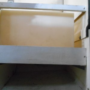 Media 'As 20 gals of water weighs 160 lbs, I used 3/4 marine ply and heavy duty aluminum angle bolted to the bulkheads.' in album 'The original tank was pulled to make room  for the AC unit.  I used a bladder tank in a couple different locations, but it just did not work out.  Moving the original tank forward took some weight off the stern and was an easy job.'