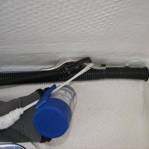 That's a plastic bag dispenser and a mesh gear hammock hanging off that cleat. Remember you must use SHORT SCREWS in this area to avoid damaging the exterior gelcoat!