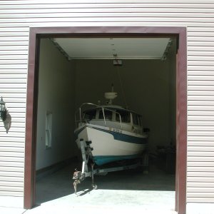 Media 'Door is 10ft wide and 12 Ft tall.  Overall, the Garage is 18 Ft wide and 34ft long inside.  Plenty of room for Captain's Choice and Kubota Tractor!' in album 'Captain's Choice new Home on the River'
