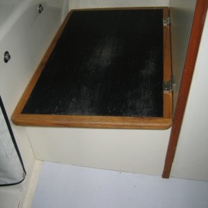 Raised step to helm 2 1/8 inch and replaced lid -- adds a little storage room.