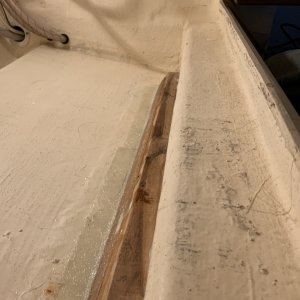 Media 'The House battery was not strapped down... rather it was sitting on the bottom ledge of the Galley and leaned against the shelf. First thing was to make a support for a 3/4\" marine ply floor, fiberglassed, glued and screwed in place for support' in album 'weight of battery had fatigued fiberglass which de-laminated'