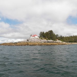 Ivory Island lighthouse on Seaforth Channel.  One of the lighthouse tenders left the job after storm waves hit the side of the house.  Understandable.