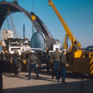 (March is best guess) 1966 - NAS So Weymouth, Mass Blimp Hanger dismantling with space capsule, Gemini, after retrieval being loaded for shipment.