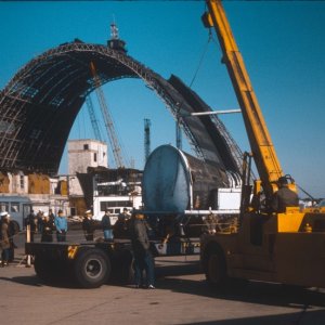 (March is best guess)1966 - NAS So Weymouth, Mass Blimp Hanger dismantling with space capsule, Gemini, after retrieval being loaded for shipment.