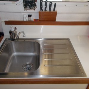 sink with very handy drain board. Note the small toggle switch by soap bottle.
electric water pump.