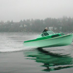 Boat #8 (2004-2008): 1956 Bell Boy 16 initially powered with just a single 25 hp Yamaha, as seen here jumping wake at Lk Washington in late 2004