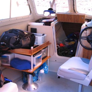 Camping shelves replace port seat