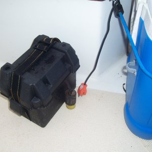 Media 'Small 12volt lawnmower battery, that plugs and plays to run the aerator. The raw water wash down fills the well. The aerator oxygenates the water. When water is added, the extra runs out the overflow, and into the cockpit drain.r' in album 'Side view'