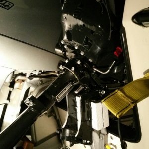 With Suzuki tilted up and strapped forward to boat