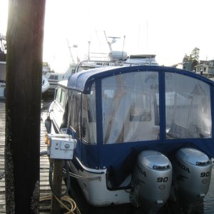the top shoulders lean outward enough for rain drainage outside the boat even with the sides off