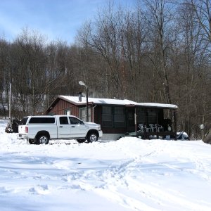 Rustic, but completely remodeled and we have power, water and satellite TV.  Wood burner is working overtime.