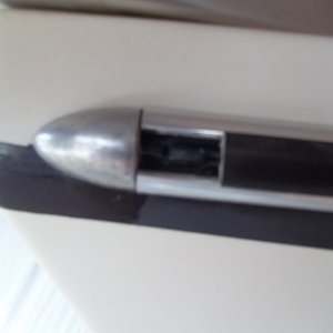 Piece of Rub rail missing, I am sure it was there last Fall when I wash my boat for the Winter. Looks like a 1.5 inch was inserted a one time and popped out.
