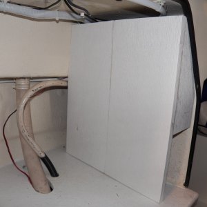 Media 'This is my new electrical cover.  It is two pieces of 10" Azek plastic trim glued together.  Cheaper than Starboard.  Hold screws better than SB.  Glues better than SB.  Floats better than SB.  I prefer adding things that float to a boat.' in album 'All of the electrical wiring just hangs loose on the back of the helm, which is in the V berth on the 16.  I've still got a few more modifications (like a negative buss bar) and then I need to cover it up.'