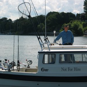 (Not For Hire) Boat at dock showing radar arch and rod holders, etc.