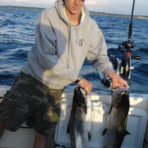 Media 'Luke with his two salmon, he cleaned his own!' in album 'Lake Michigan King, 1 of 9 taken Aug 10, 04 and a steelie too'