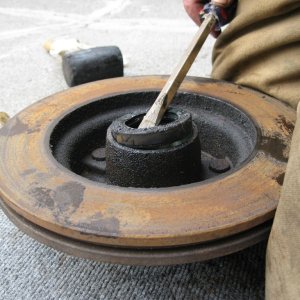Media 'Pry off rear seal with a large screwdriver.' in album 'Make sure you have placed a jack stand on each axel.  If your trailer is duel axel only remove one wheel at a time, this provides a higher level of safety.'