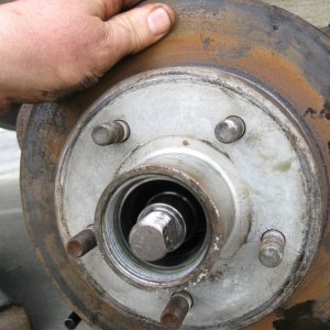 Apply a little grease to the hub or seal before sliding onto hub.