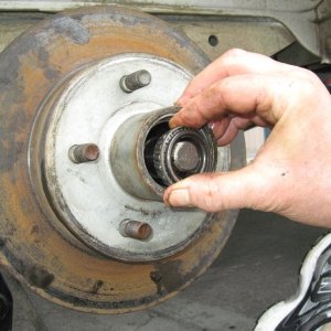 Media 'Put things back together in reverse order.' in album 'Make sure you have placed a jack stand on each axel.  If your trailer is duel axel only remove one wheel at a time, this provides a higher level of safety.'