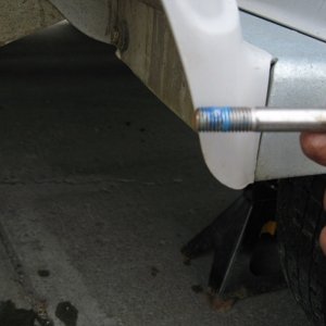 Media 'Use a little blue thread locker on the caliper bolts.' in album 'Make sure you have placed a jack stand on each axel.  If your trailer is duel axel only remove one wheel at a time, this provides a higher level of safety.'