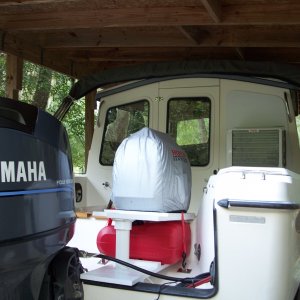 An upper shelf supports the gen, the lower shelf supports the 3gal Atwood fuel tank for extended gen run time.