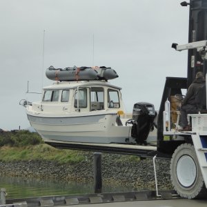 Media 'Kyle lifting the boat out Sunday morning' in album 'All set to go on a Saturday morning. New Kaboat and 2.5 Suzuki strapped to roof!'