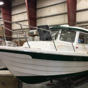 Media 'Over in the rigging area, a green stripe Venture 23' in album 'Arrival at the factory Saturday morning Aug 17 for the C-Brats tour'