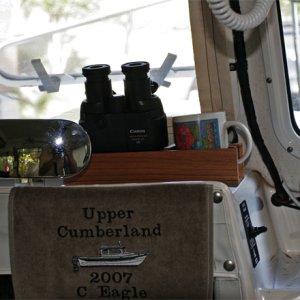 Center console covered with grippy mat.  A prized addtion is the embroidered towel given to us by Brenda Byrd at our first CD gathering. Binoc / cup holder will be mounted in front of helm. Windlass switch can be reached from helm, standing at center window or from the foredeck.