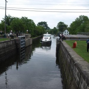 a boat coming into a dock while we are waiting to go the other way.  Notice the straps on the walls that you tie up to to secure the boat when the water comes in or goes out.