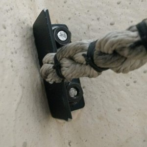 Then I made a bracket out of 1.5 inch aluminum angle to secure the bitter end of the rode. It's secured to the bow eye bolts and the rode is spliced to the bracket.