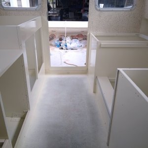 Interior reassembled, sprayed with Pettit EZ-poxy.  My biggest complaint was recoat time which was 16hrs. I would use the Performance enhancer if I was to do again.