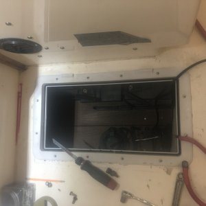 Built platform with trex. Screwed battery boxes down, accessible from this hatch or from the hatch under the sink.