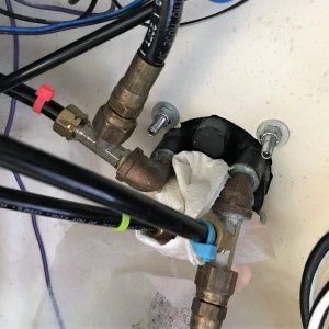 Back of Helm after new hydraulic lines installed. Paper towel stuck in middle to absorb slight leakage during colder months