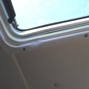 14. Hook Velcro attached to hatch cover trim.