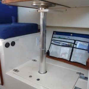 15. Magazine and book storage under the galley table.