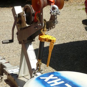 Media 'OOOPS INSPIRED: Added 7100Lb W/L heavy equipment ratchet chain binder (foldable handle) to tie down front end as second safety chain. Secured to bow post and main trailer beam with 1/2" galv. chain. Should not come up again (or forward) unless I lose the bow eye. Chain is linked under trailer with a full oval screw on connector and locked with a padlock as anti theft precaution. I'm not intending to put this in a thread until it has been well tested.' in album 'Bought used 03 EZ Alum tandem to replace single axle. Refitting for CD. Sun canopy for working in the heat!'