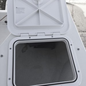 New hatch bedded with butyl rubber and fastened.